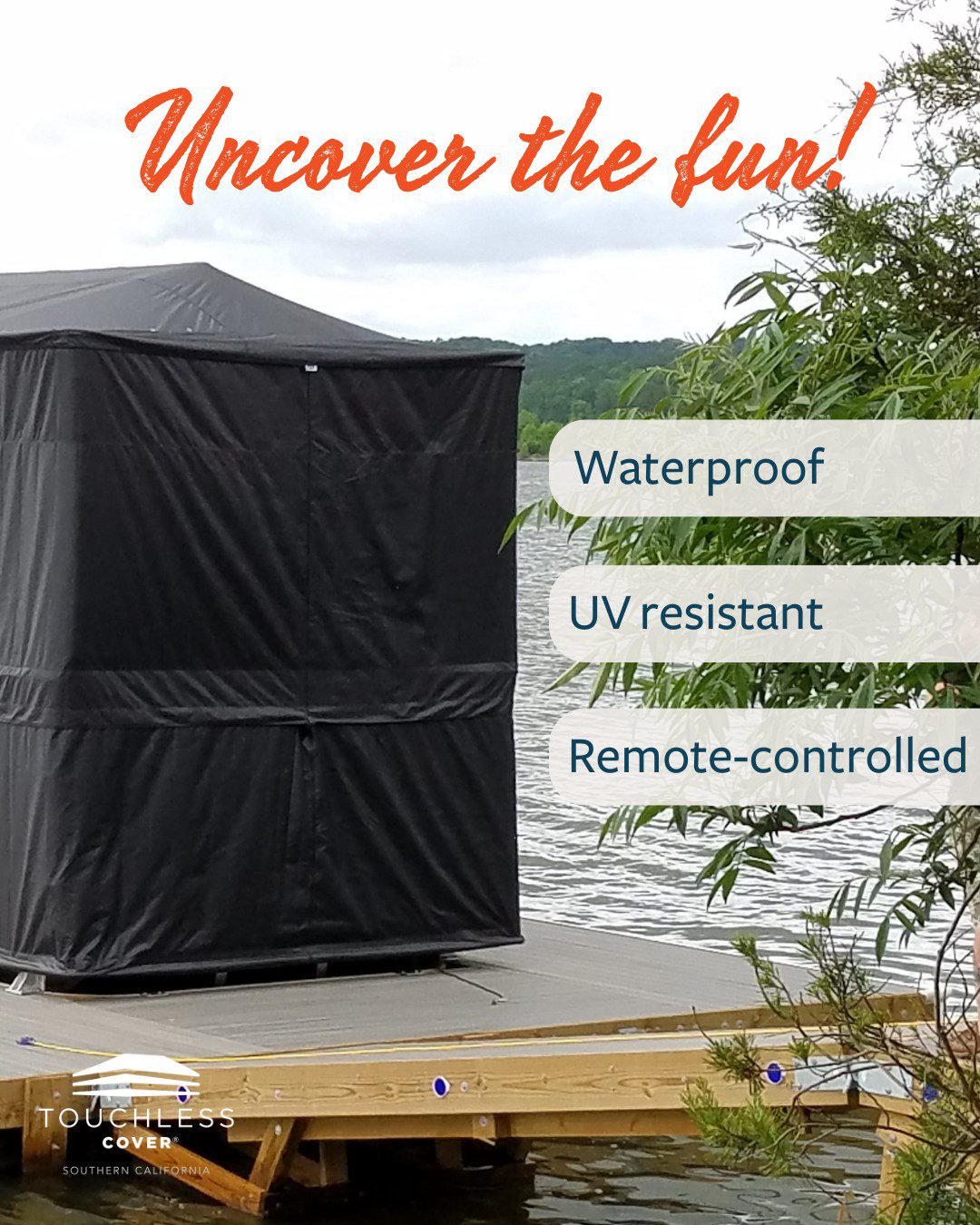A sleek black Touchless Cover® shields a dockside boat with waterproof, UV-resistant, remote-controlled protection. Set against a calm lake and greenery, the cover embodies hassle-free dockside living—keeping boats pristine and ready in seconds without the strain of heavy, tangled covers.