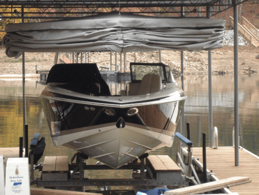 Boat on a lift with a Touchless Cover system above it