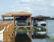 Two Touchless Boat Covers installed side by side, protecting deck boats