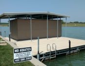 Pontoon boat protected under Touchless Boat Cover outdoors