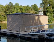 Dock sheltering boat with Touchless Automatic Boat Cover
