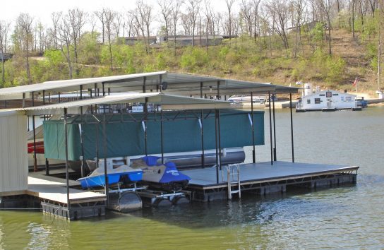 Green Touchless Pontoon Boat Cover in lowered position
