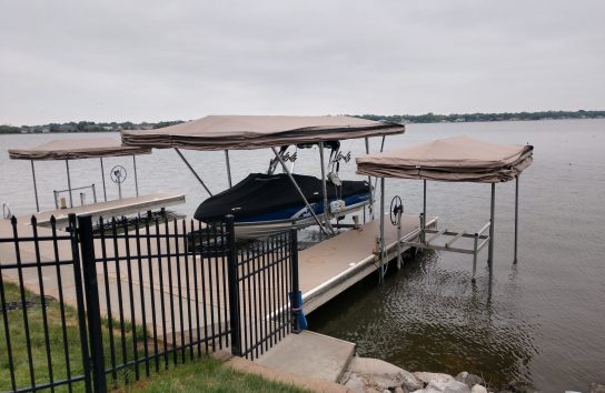 Boat dock with ski boat and Touchless Automatic Cover, ready for use.