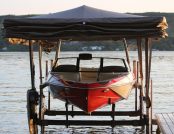Docked Ski Boat Sheltered by Touchless Automatic Cover
