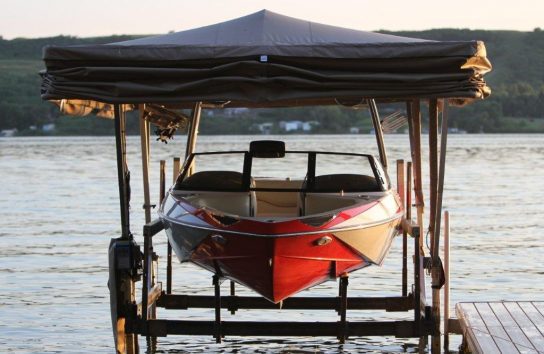 Docked Ski Boat Sheltered by Touchless Automatic Cover